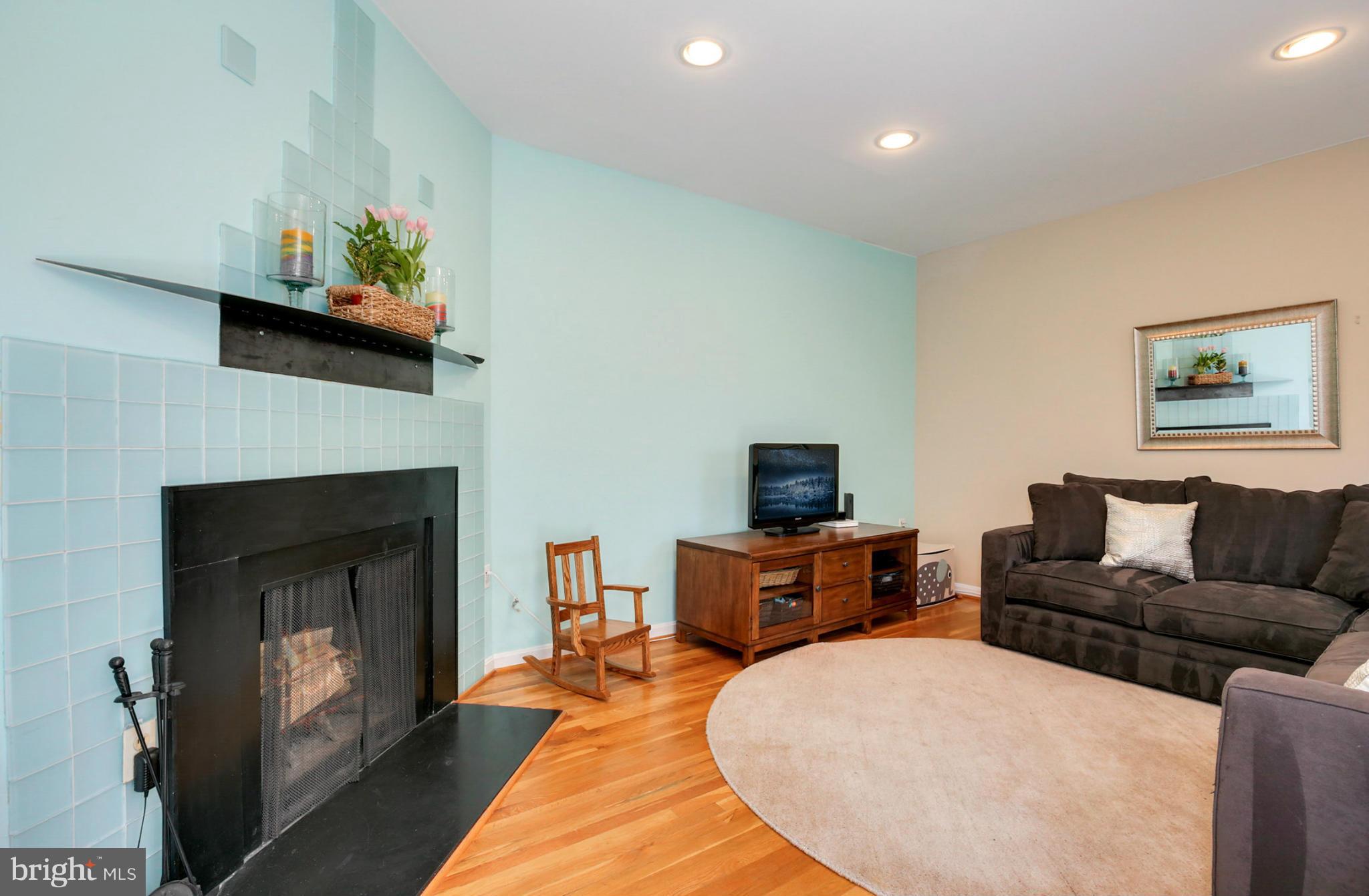 1454 Euclid Street Northwest, Unit 7 Washington, DC 20009 - Photo 11 of 23 a living room with furniture and a fireplace