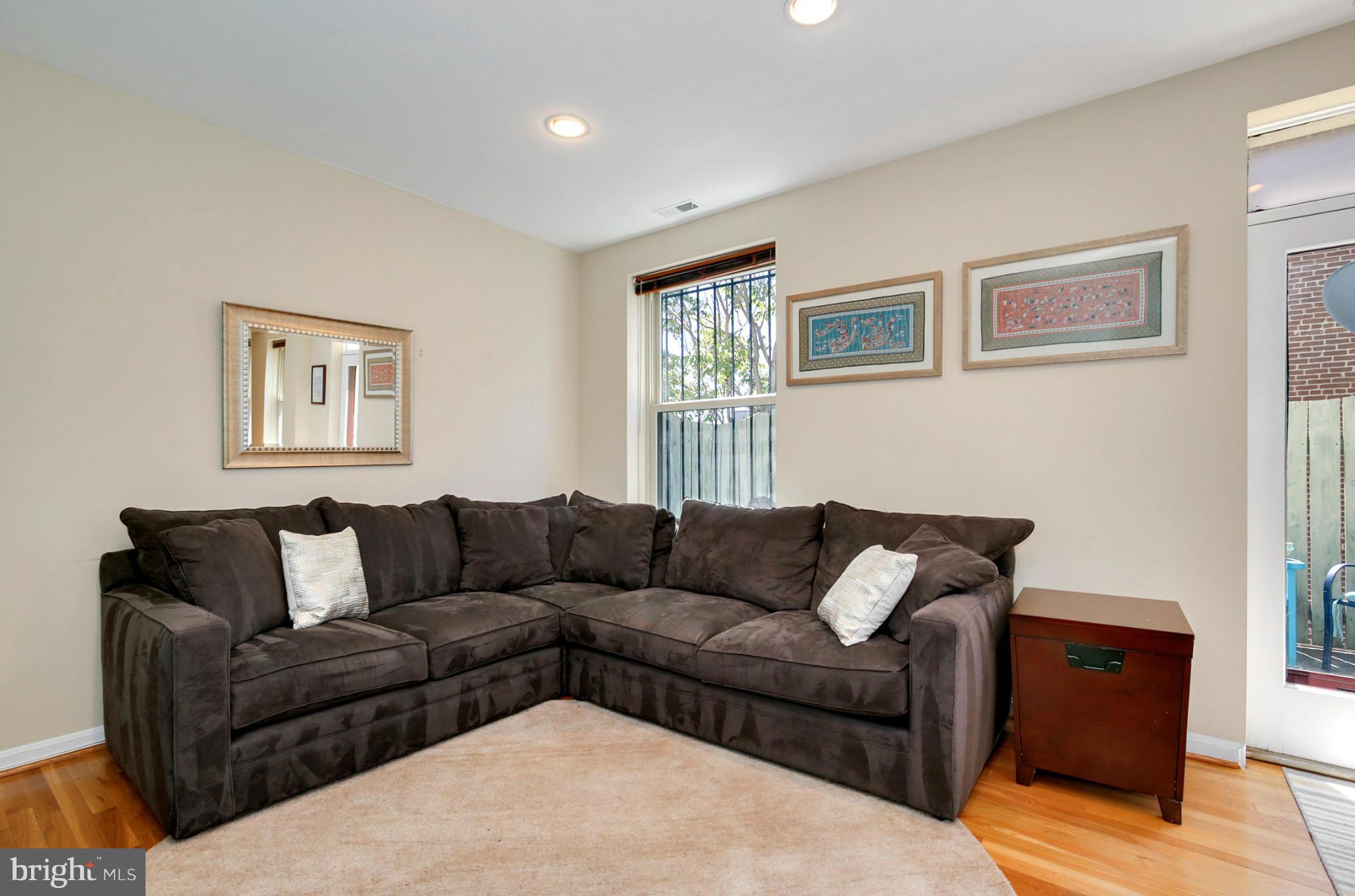 1454 Euclid Street Northwest, Unit 7 Washington, DC 20009 - Photo 12 of 23 a living room with furniture and a couch