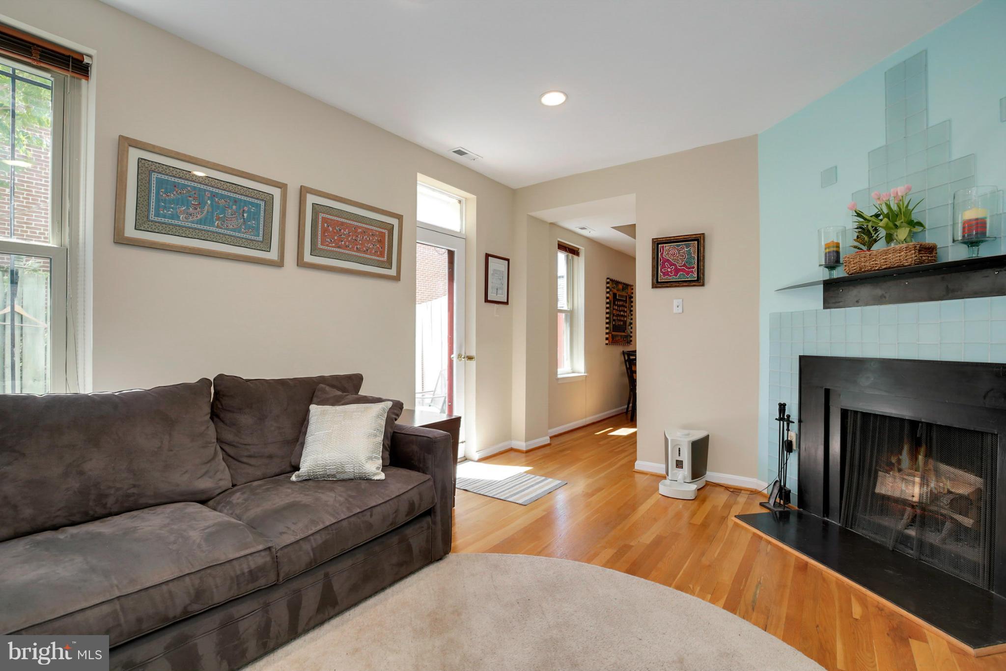 1454 Euclid Street Northwest, Unit 7 Washington, DC 20009 - Photo 13 of 23 a living room with furniture and a fireplace