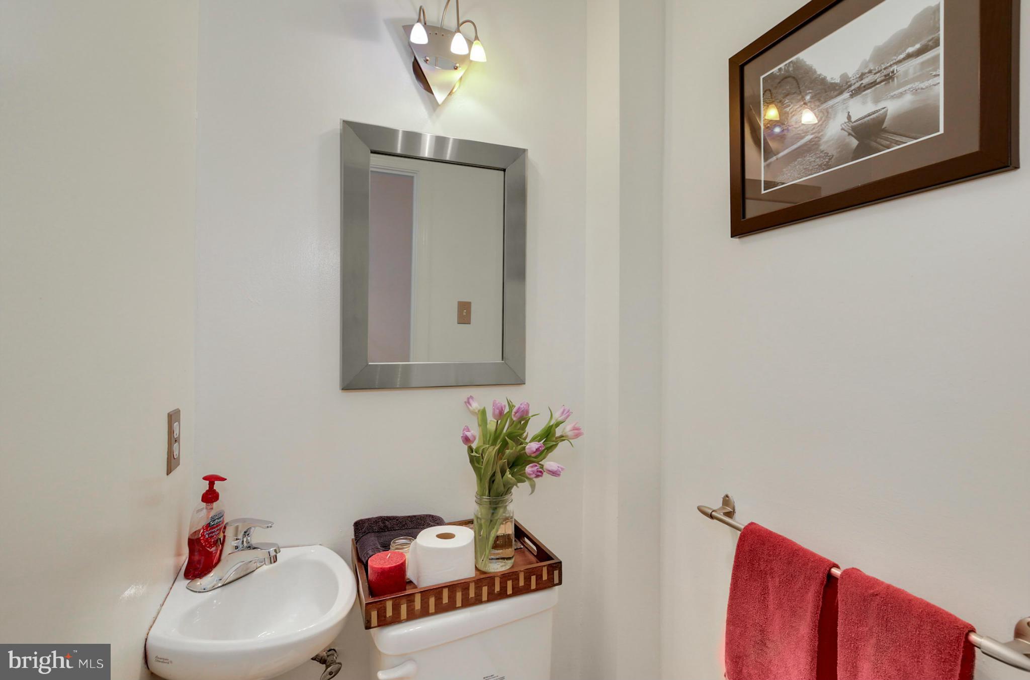 1454 Euclid Street Northwest, Unit 7 Washington, DC 20009 - Photo 14 of 23 a bathroom with a toilet sink and mirror