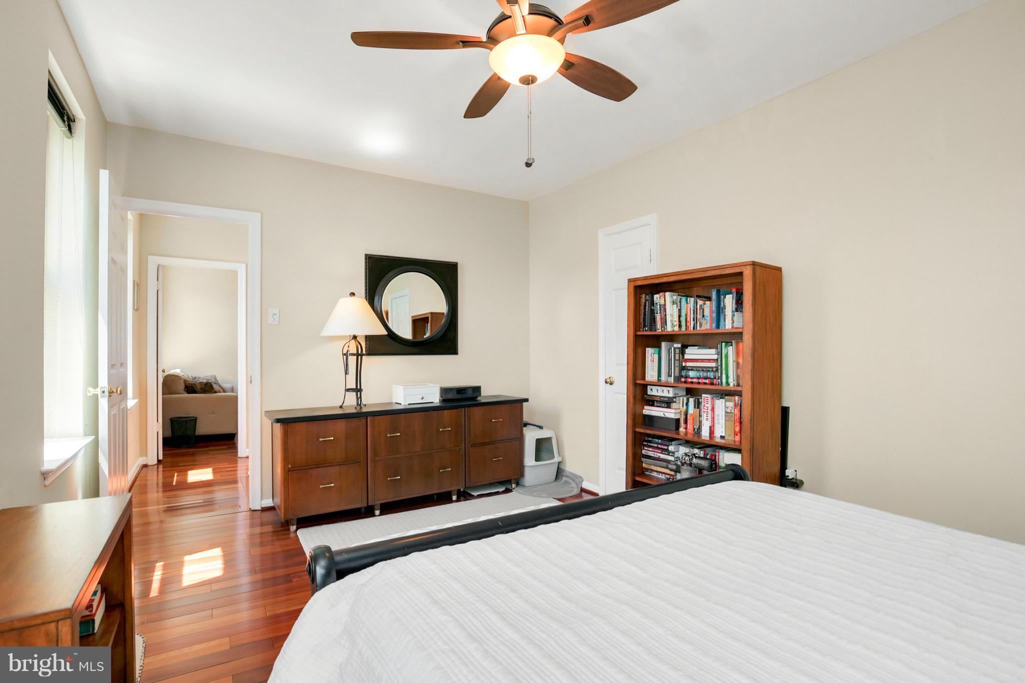 1454 Euclid Street Northwest, Unit 7 Washington, DC 20009 - Photo 18 of 23 a bedroom with a bed and a chandelier
