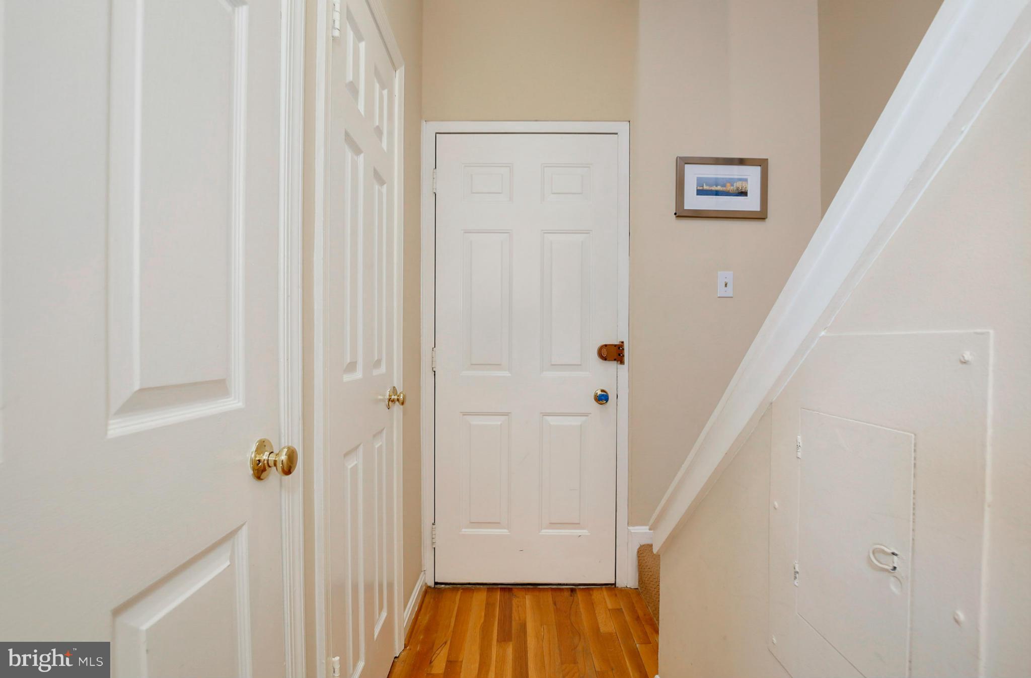 1454 Euclid Street Northwest, Unit 7 Washington, DC 20009 - Photo 3 of 23 a view of a hallway with wooden floor and entryway