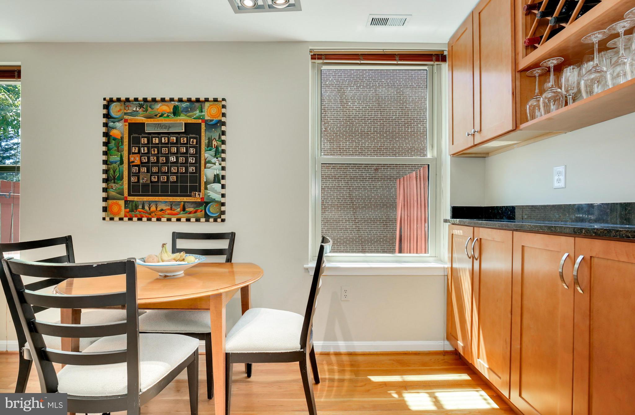 1454 Euclid Street Northwest, Unit 7 Washington, DC 20009 - Photo 7 of 23 a dining room with a table and chairs