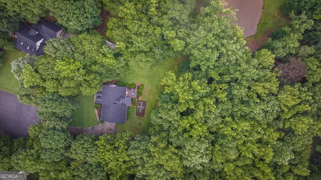 a view of a backyard with sitting area