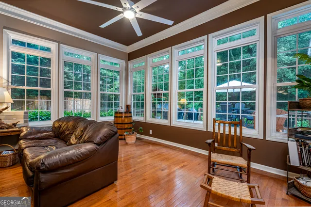a kitchen with granite countertop a stove dining table and chairs