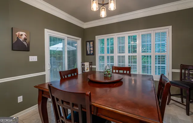 a kitchen with kitchen island granite countertop wooden cabinets and a stove