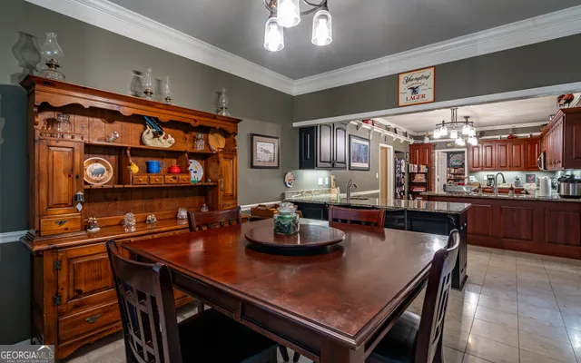 a kitchen with sink and wooden cabinets