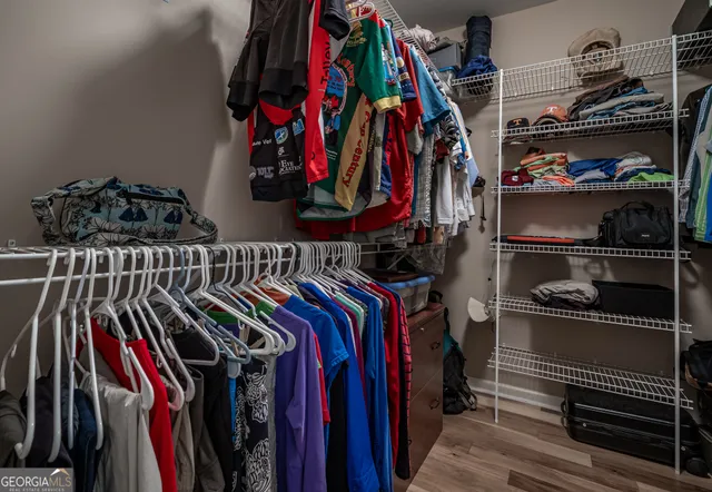 a bedroom with a bed and dresser