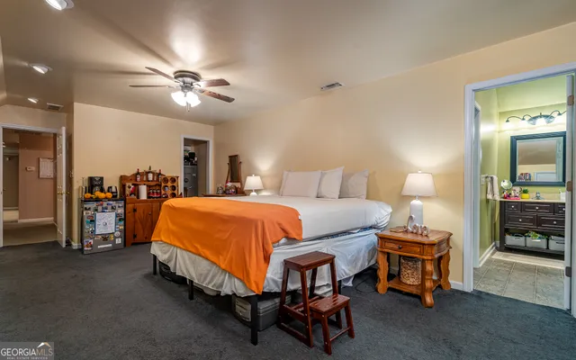 a view of walk in closet with clothes