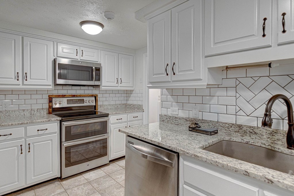 6101 River Road, Unit 5 Columbus, GA 31904 - Photo 17 of 47 a kitchen with cabinets stainless steel appliances and a sink