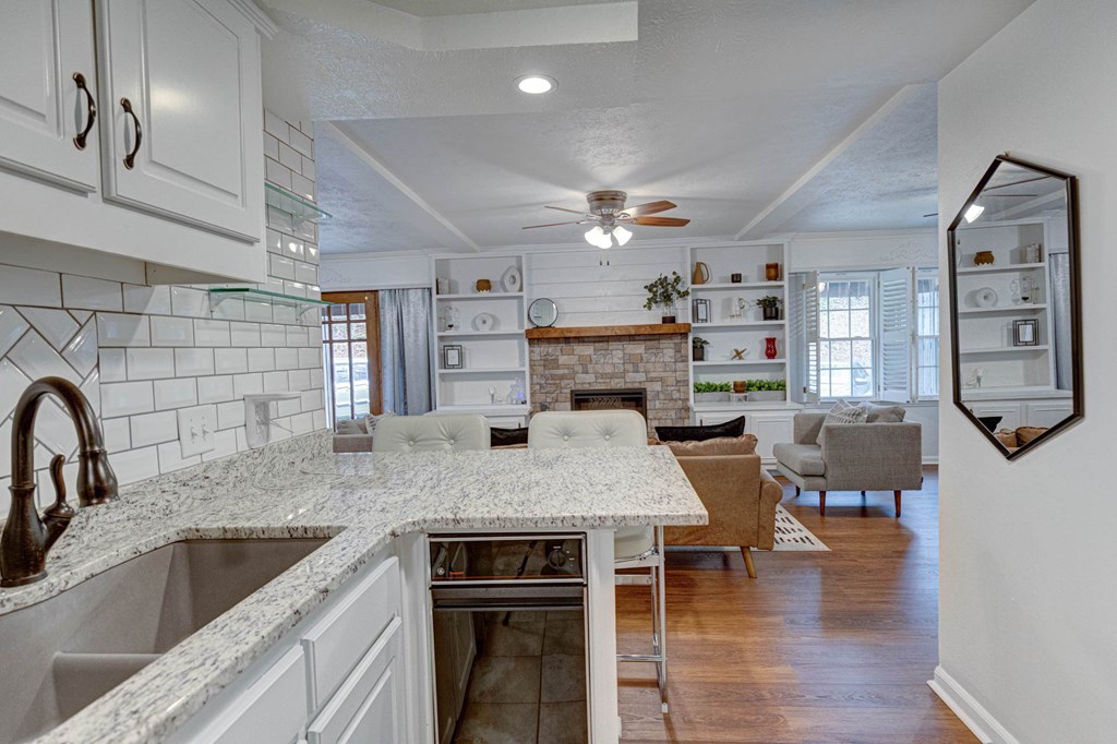 6101 River Road, Unit 5 Columbus, GA 31904 - Photo 18 of 47 a kitchen with stainless steel appliances granite countertop a kitchen island a stove and a sink