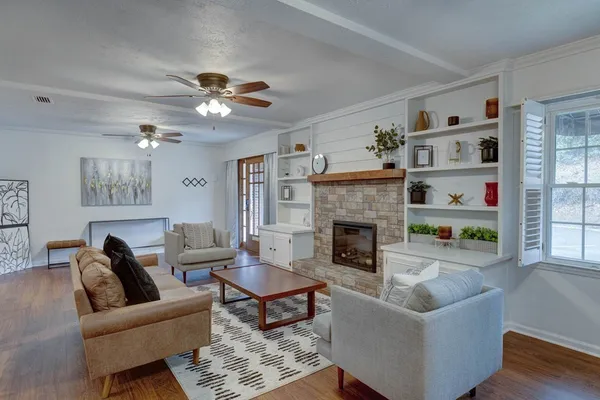 a living room with furniture and a fireplace