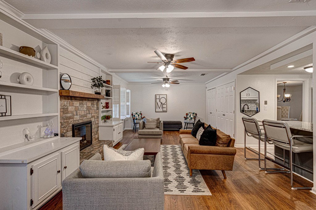 6101 River Road, Unit 5 Columbus, GA 31904 - Photo 2 of 47 a living room with furniture a fireplace and a flat screen tv
