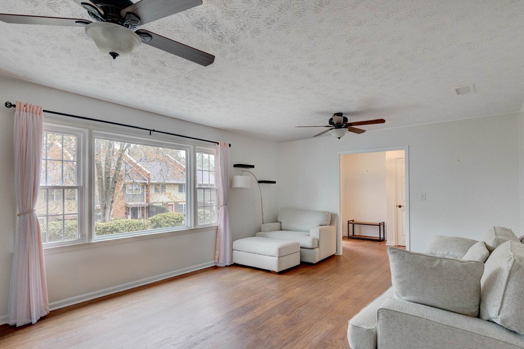 6101 River Road, Unit 5 Columbus, GA 31904 - Photo 21 of 47 a living room with furniture and a large window