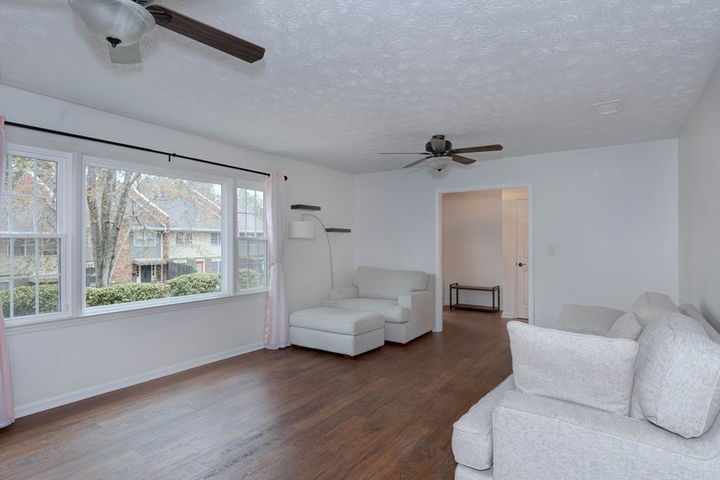 6101 River Road, Unit 5 Columbus, GA 31904 - Photo 22 of 47 a living room with furniture and a large window