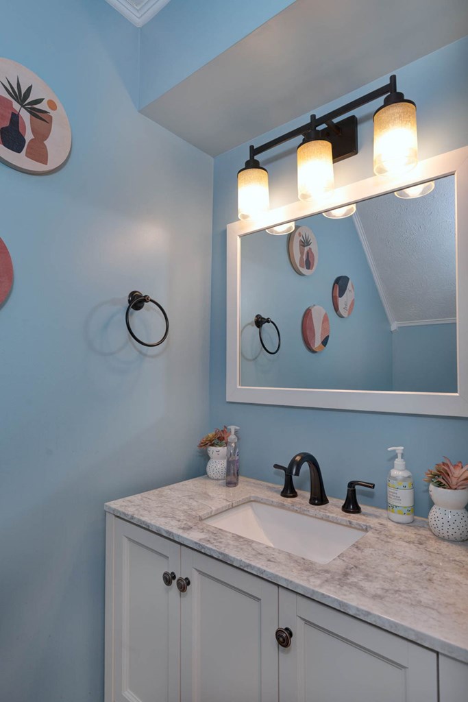 6101 River Road, Unit 5 Columbus, GA 31904 - Photo 25 of 47 a bathroom with a granite countertop sink and a mirror