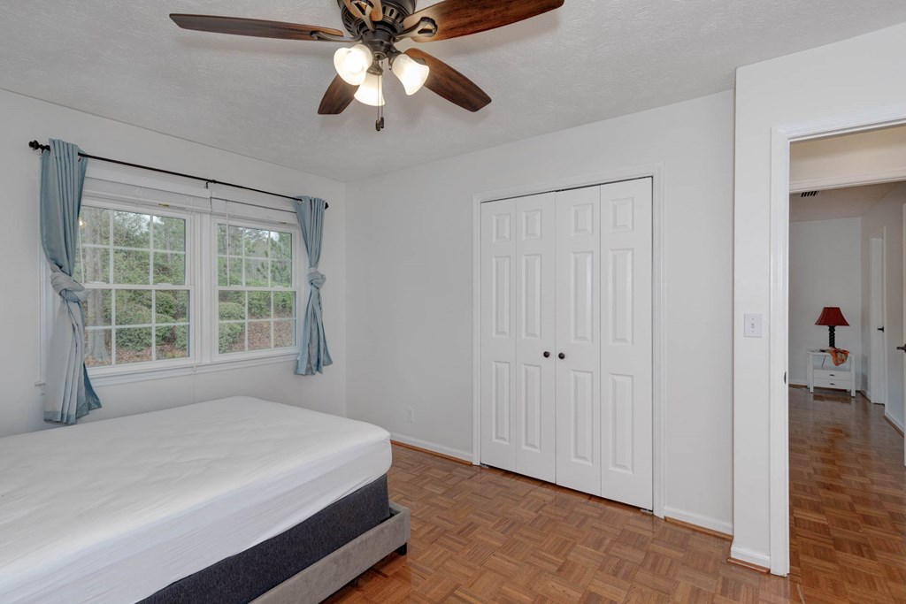 6101 River Road, Unit 5 Columbus, GA 31904 - Photo 32 of 47 a bedroom with a large bed and a window