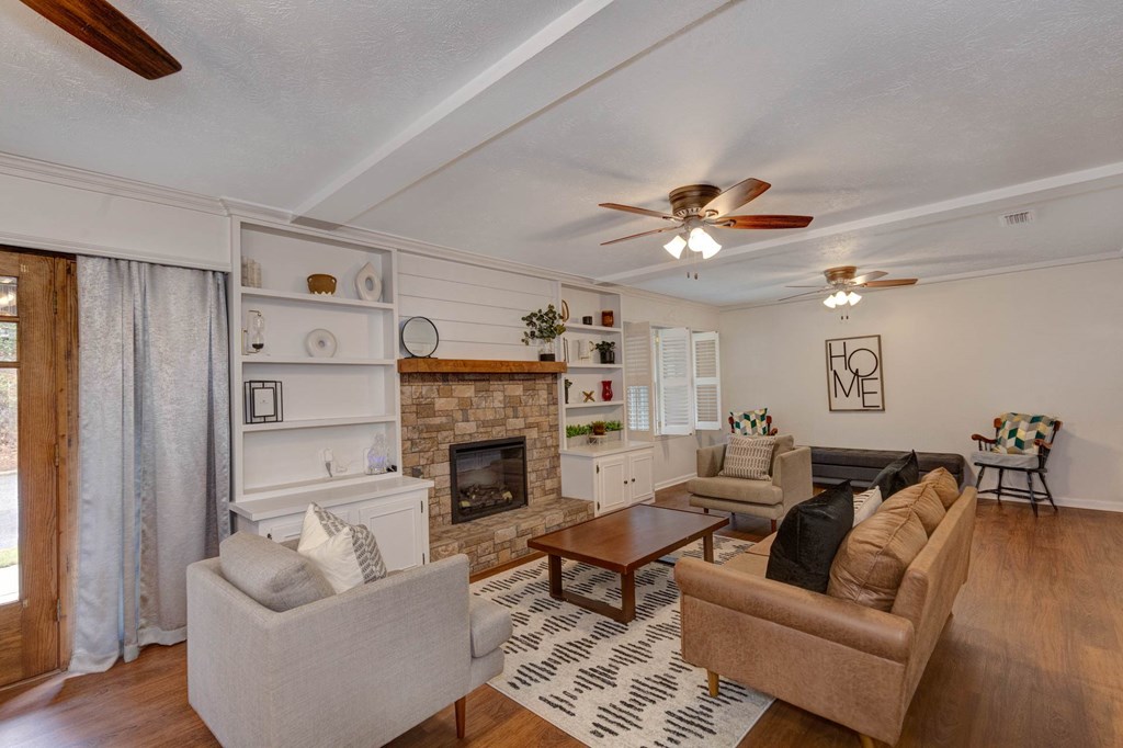 6101 River Road, Unit 5 Columbus, GA 31904 - Photo 33 of 47 a living room with furniture and a fireplace