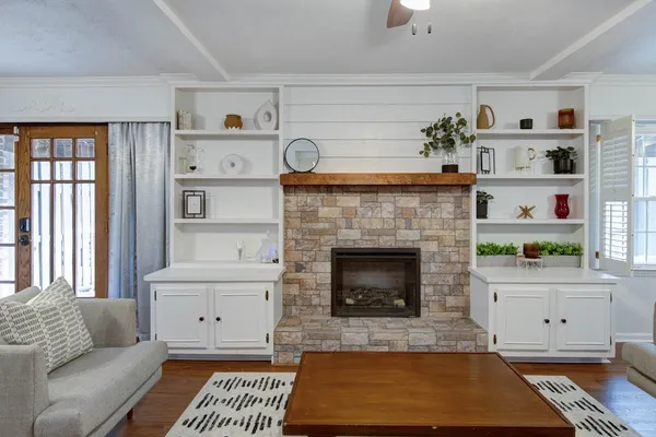 a living room with furniture and a fireplace