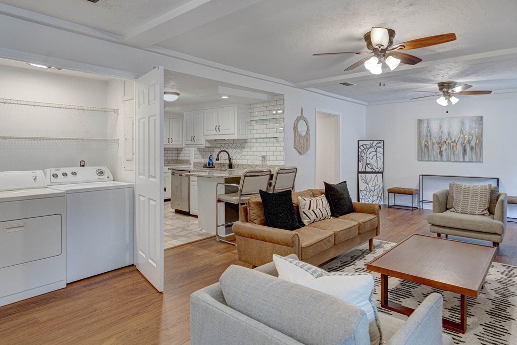 6101 River Road, Unit 5 Columbus, GA 31904 - Photo 38 of 47 a living room with furniture kitchen view and a chandelier