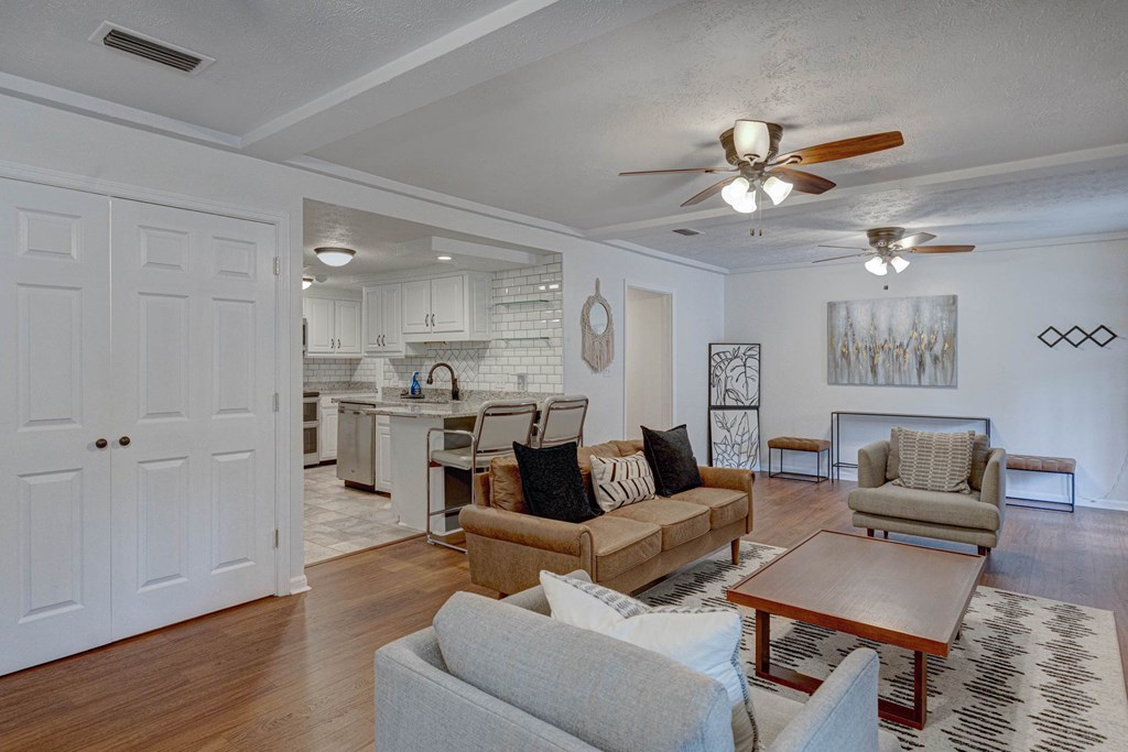 6101 River Road, Unit 5 Columbus, GA 31904 - Photo 39 of 47 a living room with furniture kitchen view and a wooden floor