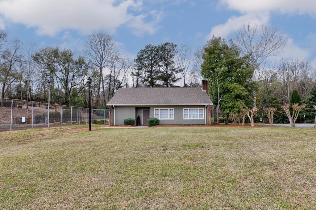 6101 River Road, Unit 5 Columbus, GA 31904 - Photo 43 of 47 a big house with trees in front of it