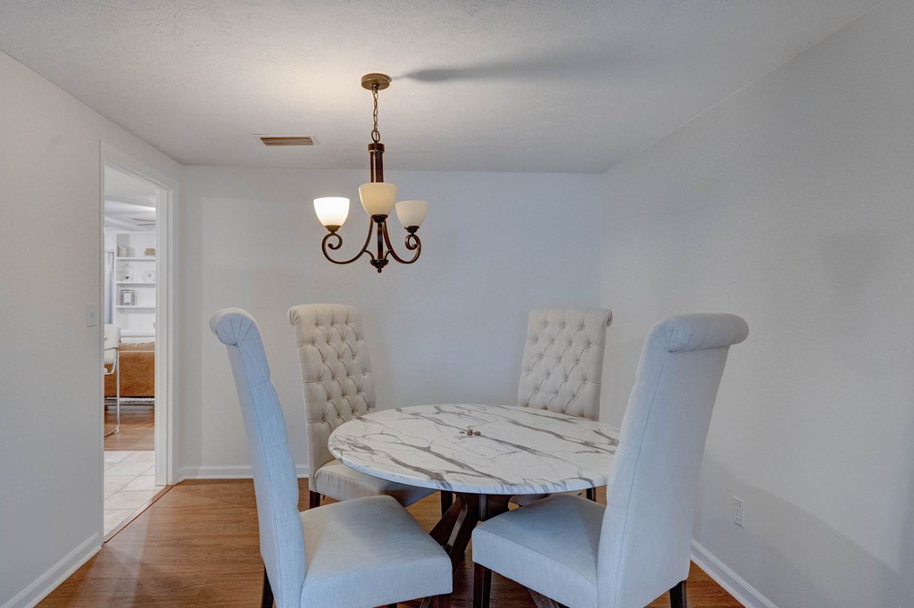 6101 River Road, Unit 5 Columbus, GA 31904 - Photo 5 of 47 a view of a dining room with furniture and wooden floor