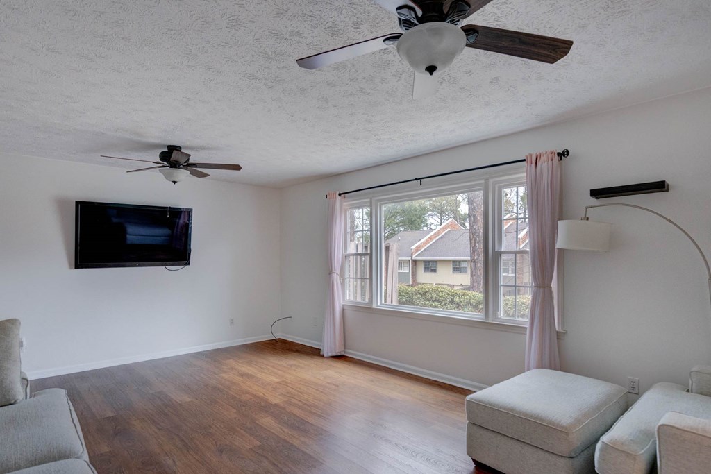 6101 River Road, Unit 5 Columbus, GA 31904 - Photo 7 of 47 a living room with furniture and a flat screen tv
