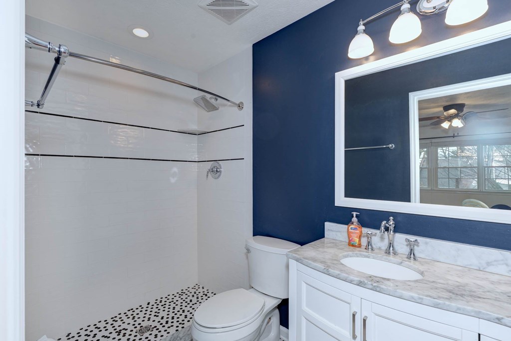 6101 River Road, Unit 5 Columbus, GA 31904 - Photo 8 of 47 a bathroom with a granite countertop sink toilet and shower