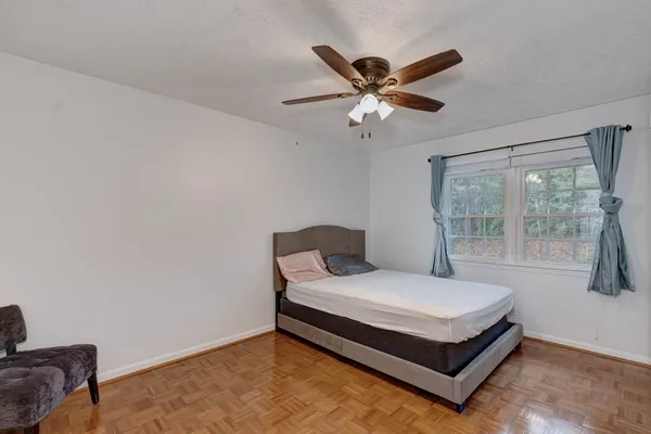 a bedroom with a bed and window