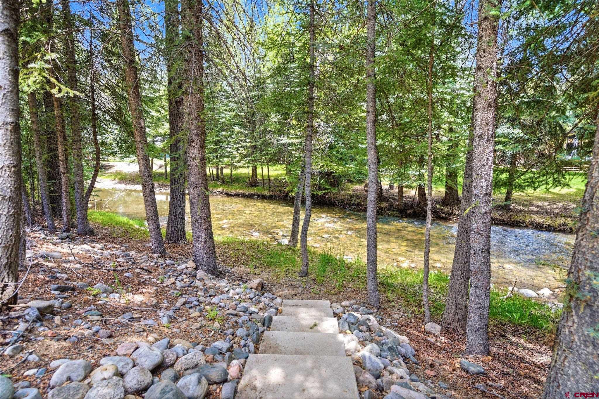 197 Hummingbird Way Bayfield, CO 81122 - Photo 38 of 44 a view of a yard with a tree