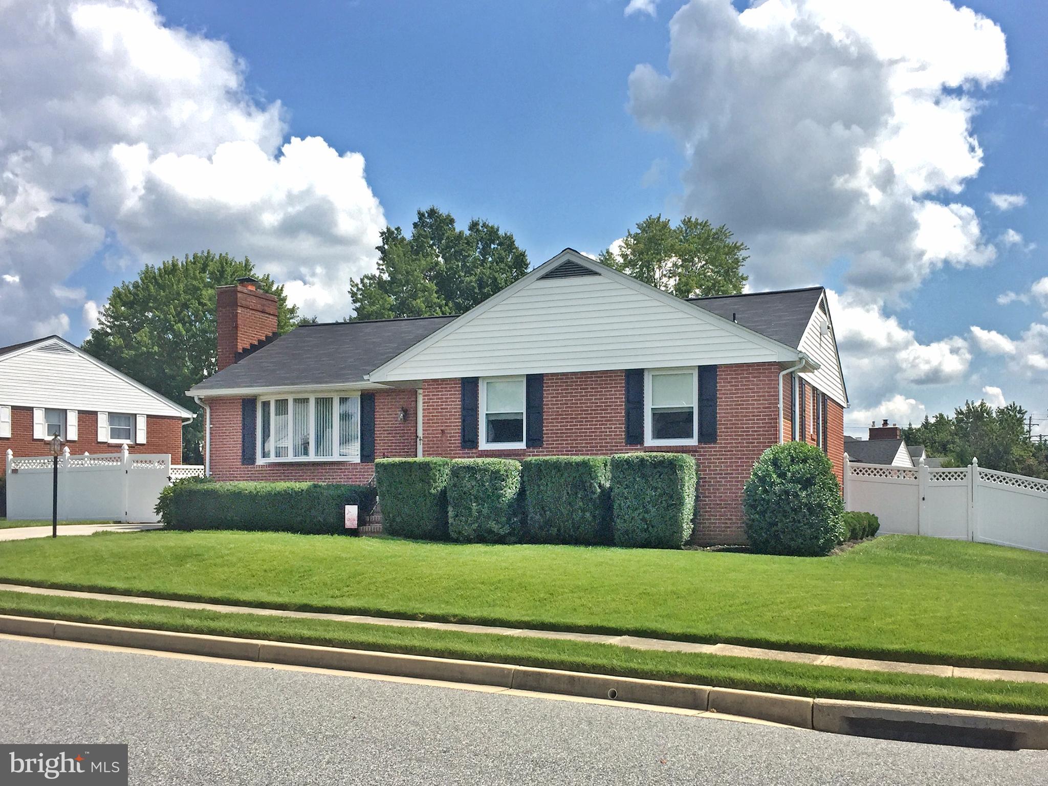 9501 Dawnvale Road Baltimore, MD 21236 - Photo 2 of 30 a front view of a house with a garden