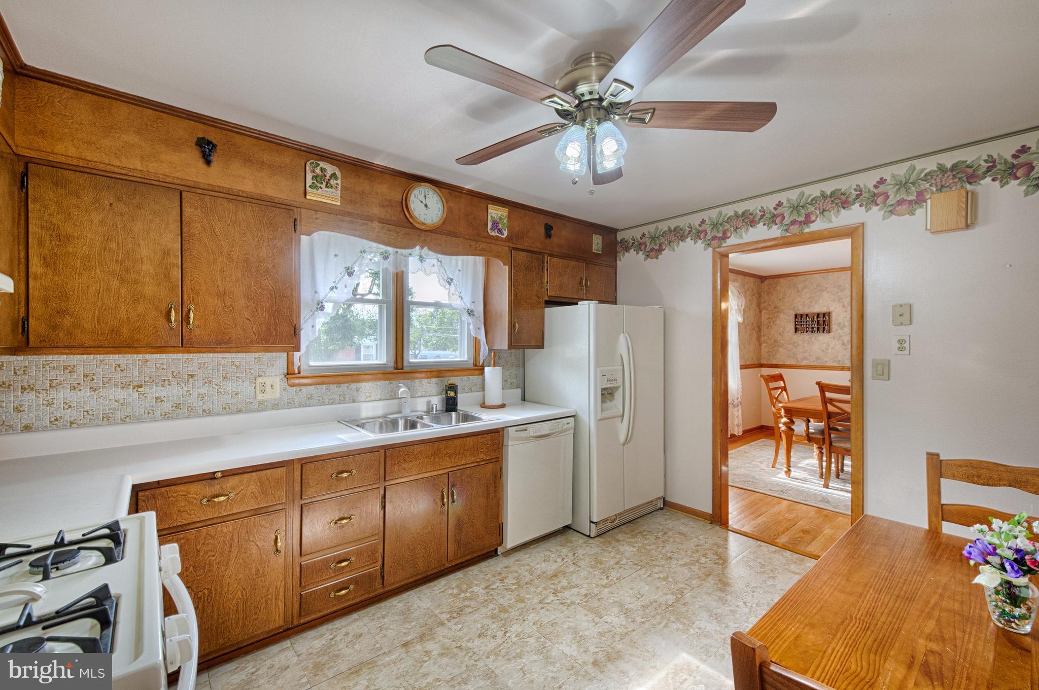 9501 Dawnvale Road Baltimore, MD 21236 - Photo 12 of 30 a large kitchen with a sink appliances and cabinets