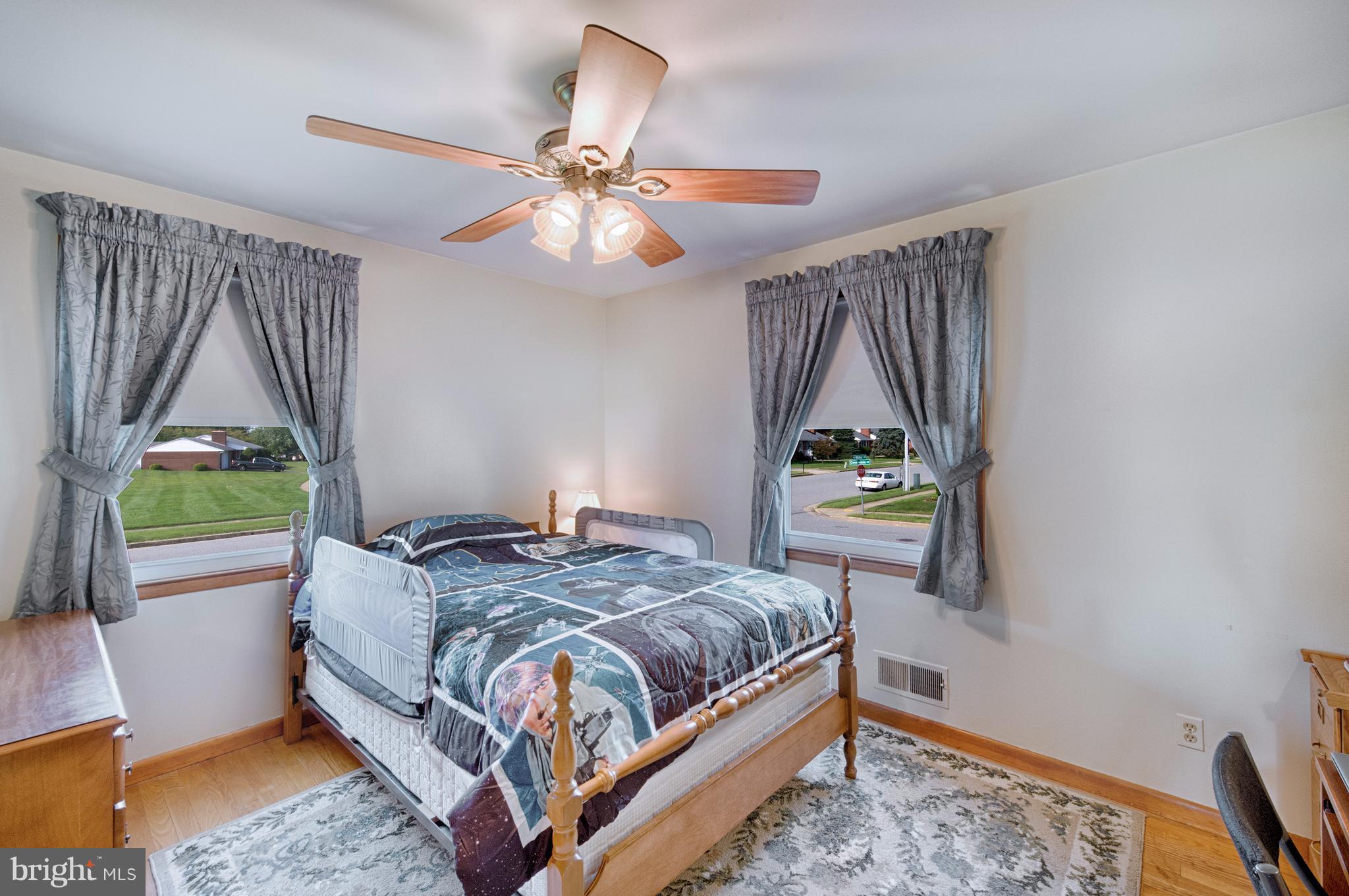 9501 Dawnvale Road Baltimore, MD 21236 - Photo 15 of 30 a bedroom with a bed and a window