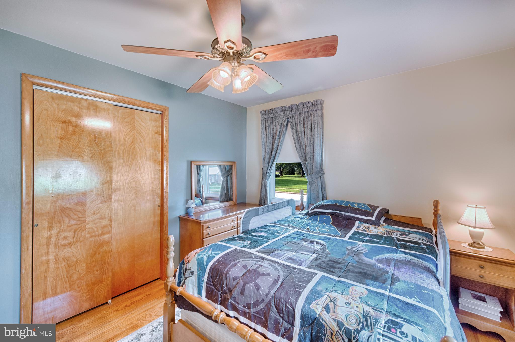 9501 Dawnvale Road Baltimore, MD 21236 - Photo 16 of 30 a bedroom with a bed and a window