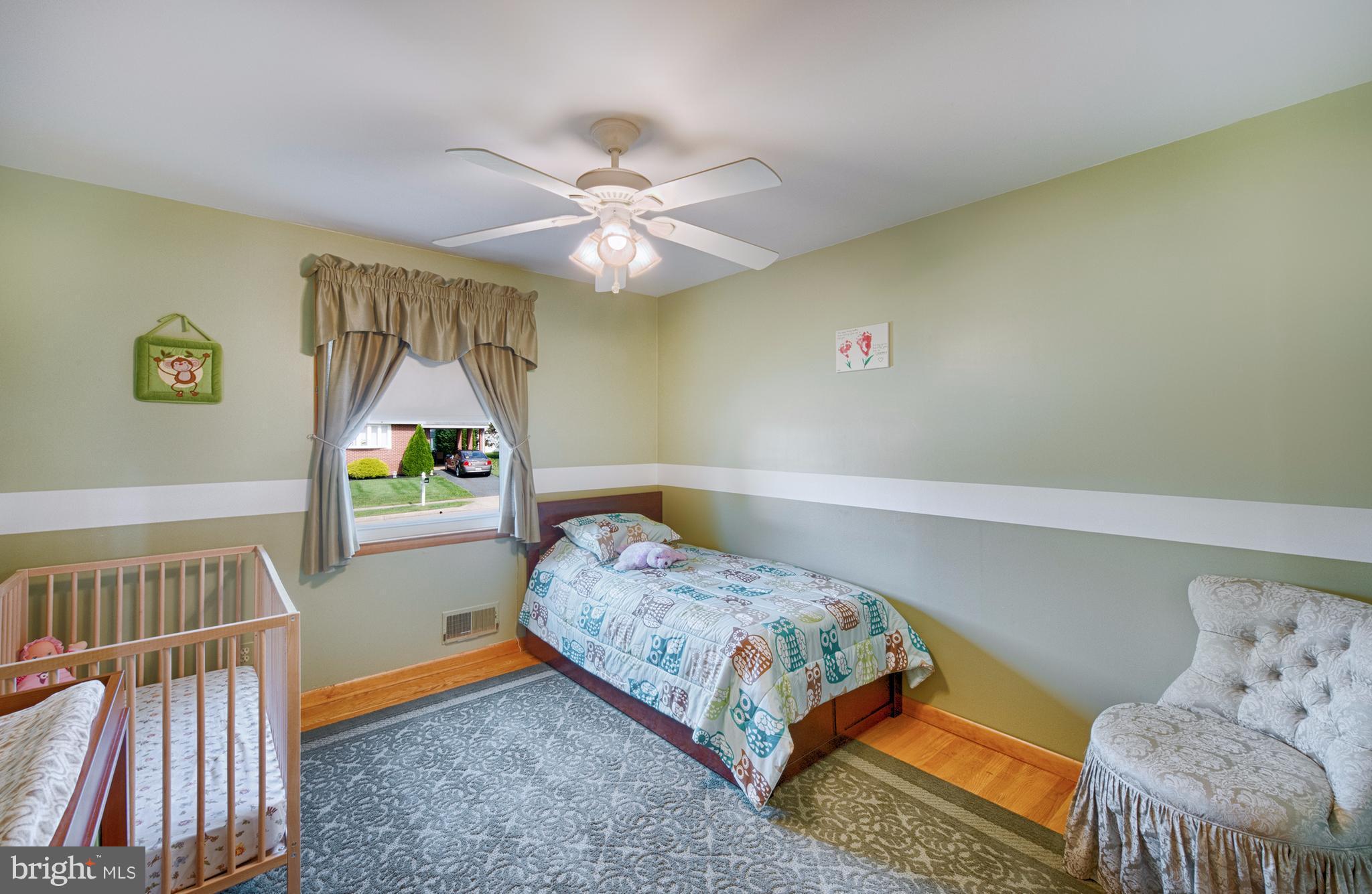 9501 Dawnvale Road Baltimore, MD 21236 - Photo 17 of 30 a bedroom with a bed and a window