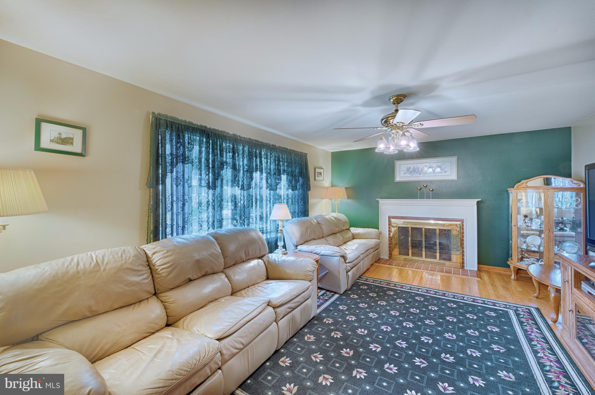 9501 Dawnvale Road Baltimore, MD 21236 - Photo 5 of 30 a living room with furniture and a fireplace