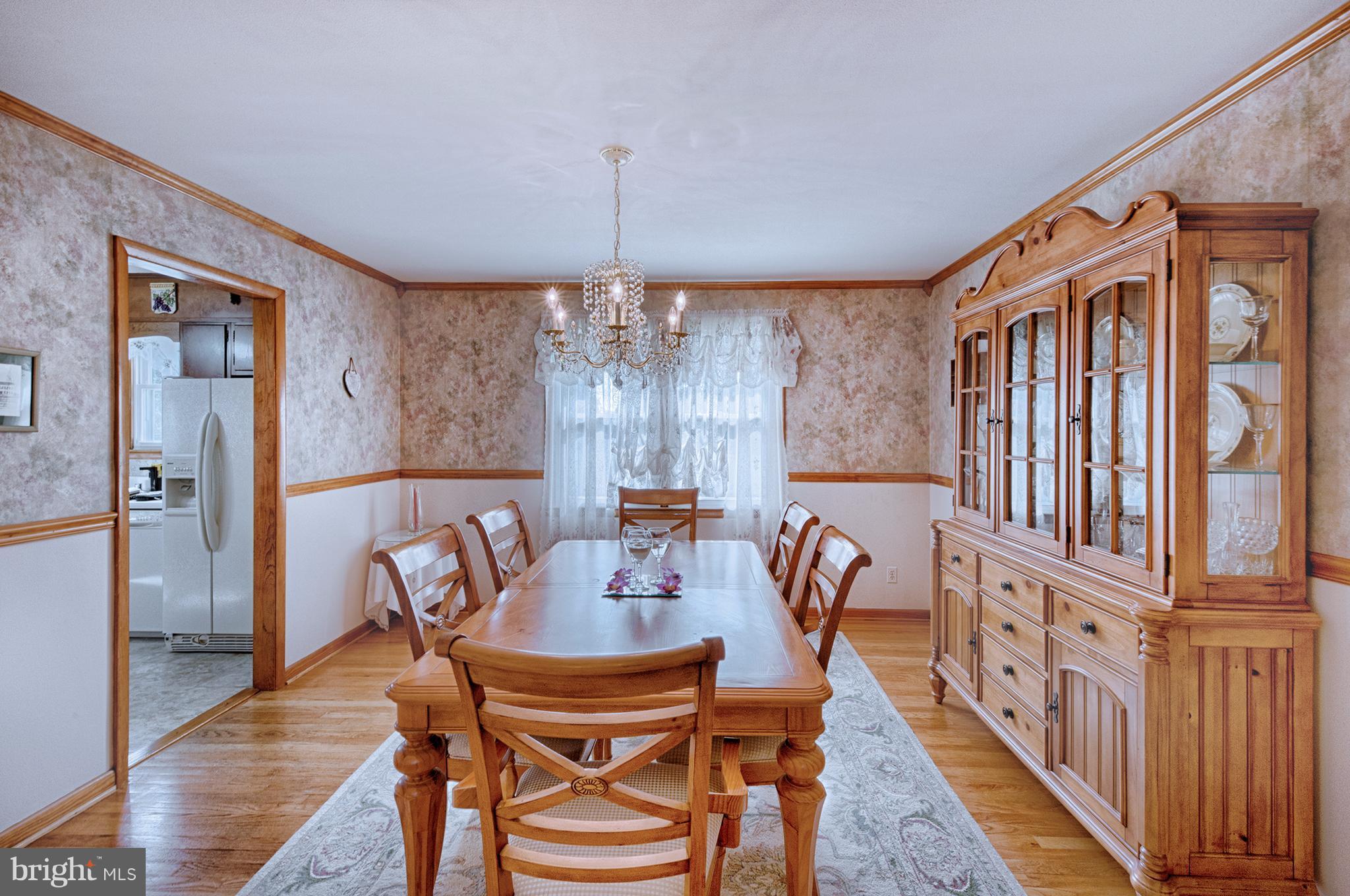 9501 Dawnvale Road Baltimore, MD 21236 - Photo 8 of 30 a view of a a dining room with furniture window and wooden floor