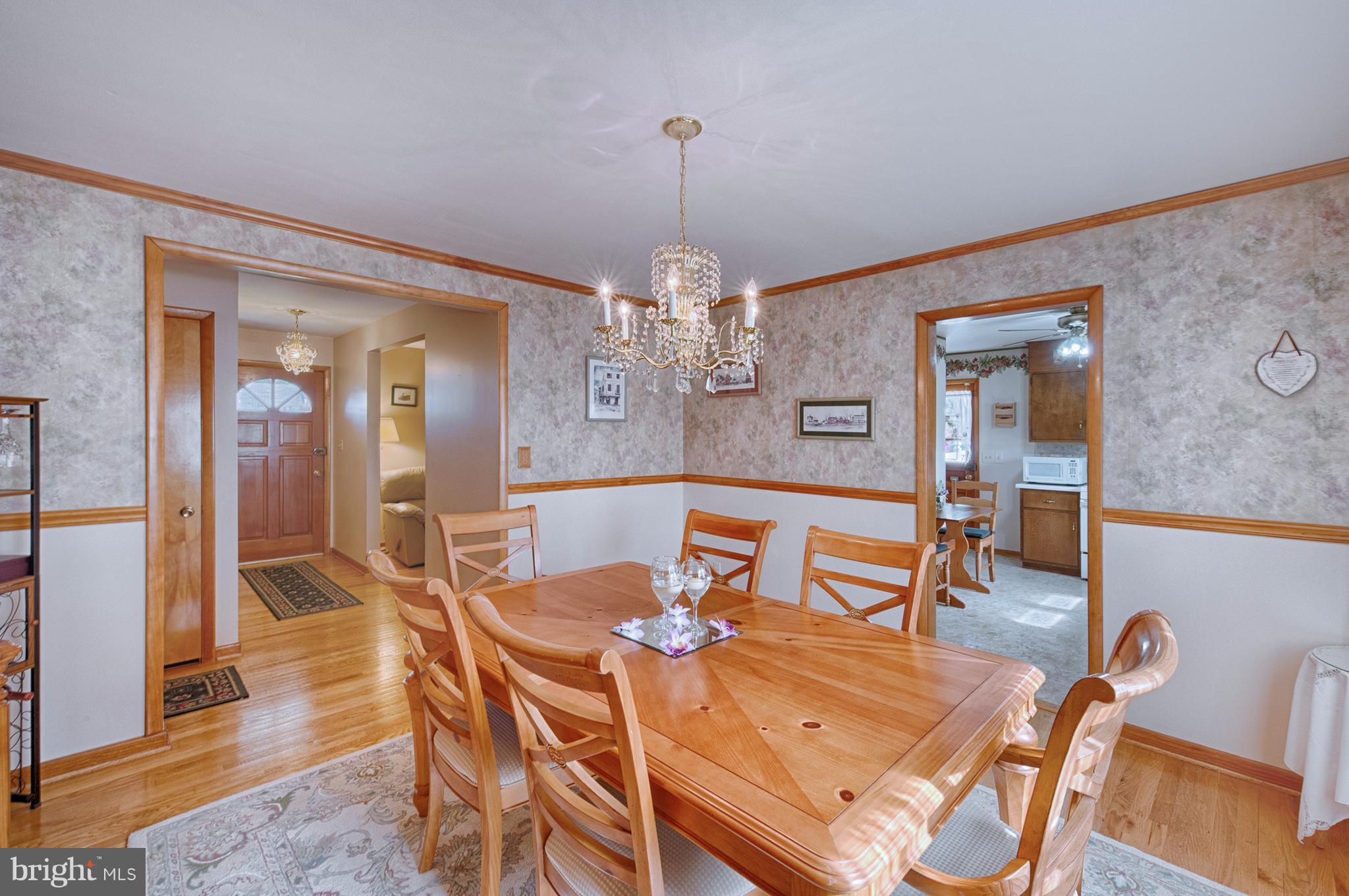 9501 Dawnvale Road Baltimore, MD 21236 - Photo 9 of 30 a view of a dining room with furniture and wooden floor