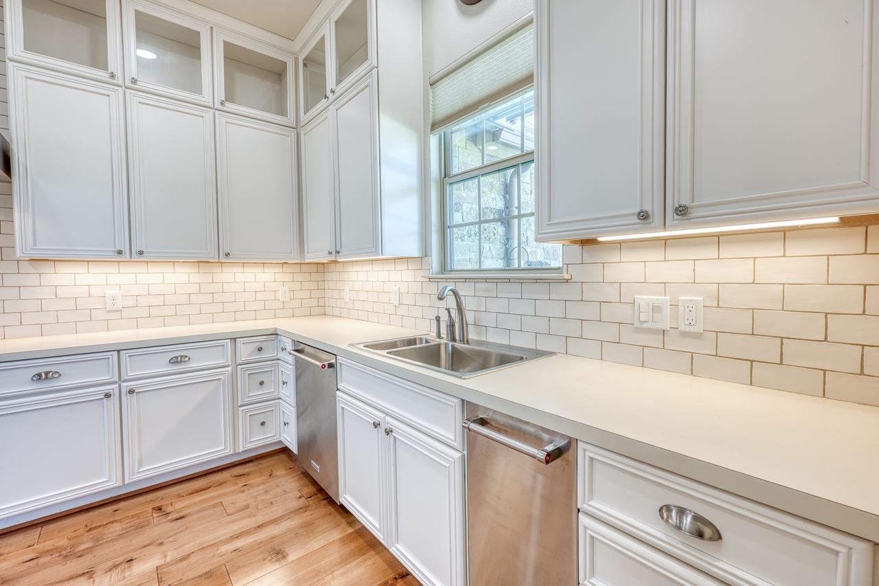 229 Eagle Ridge Burnet, TX 78611 - Photo 12 of 30 a kitchen with a sink cabinets and window