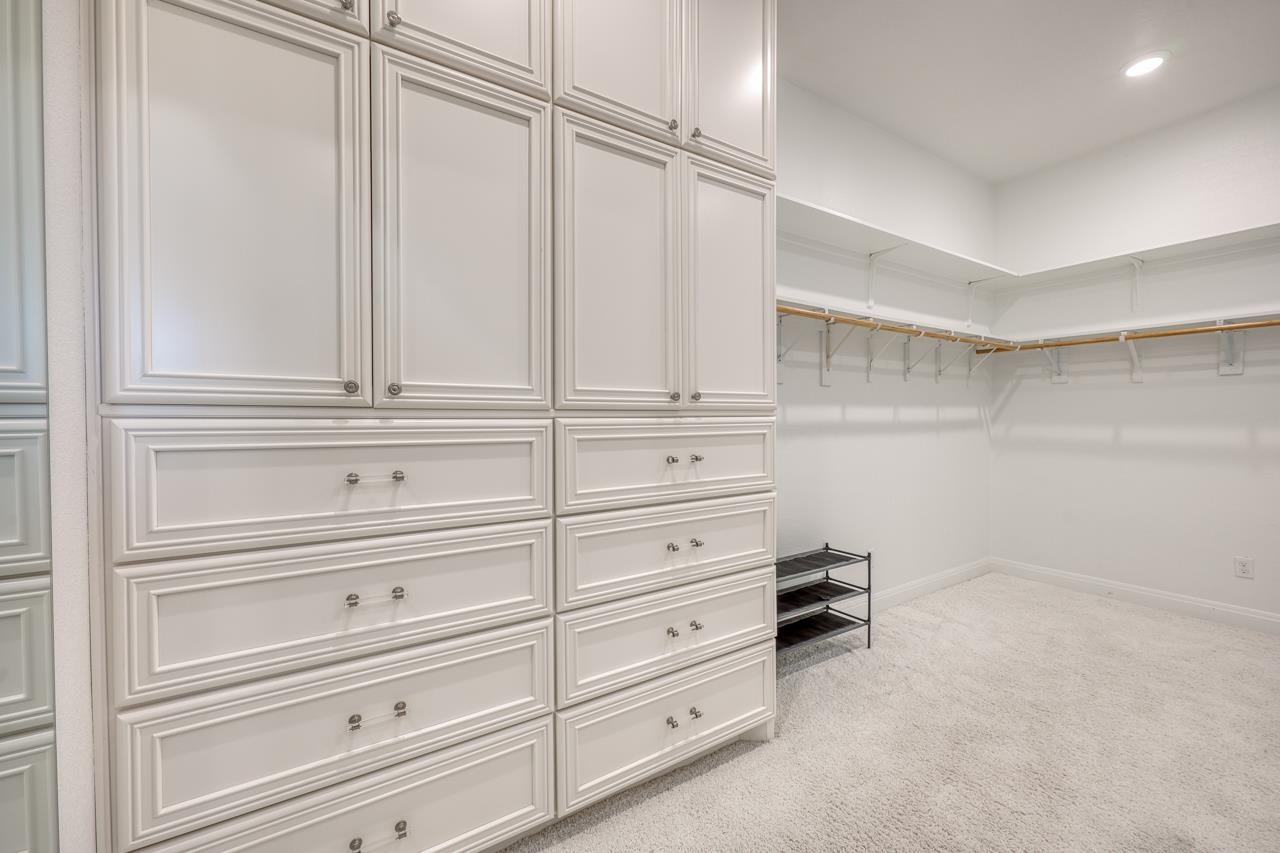 229 Eagle Ridge Burnet, TX 78611 - Photo 20 of 30 walk in closet with white cabinets and window