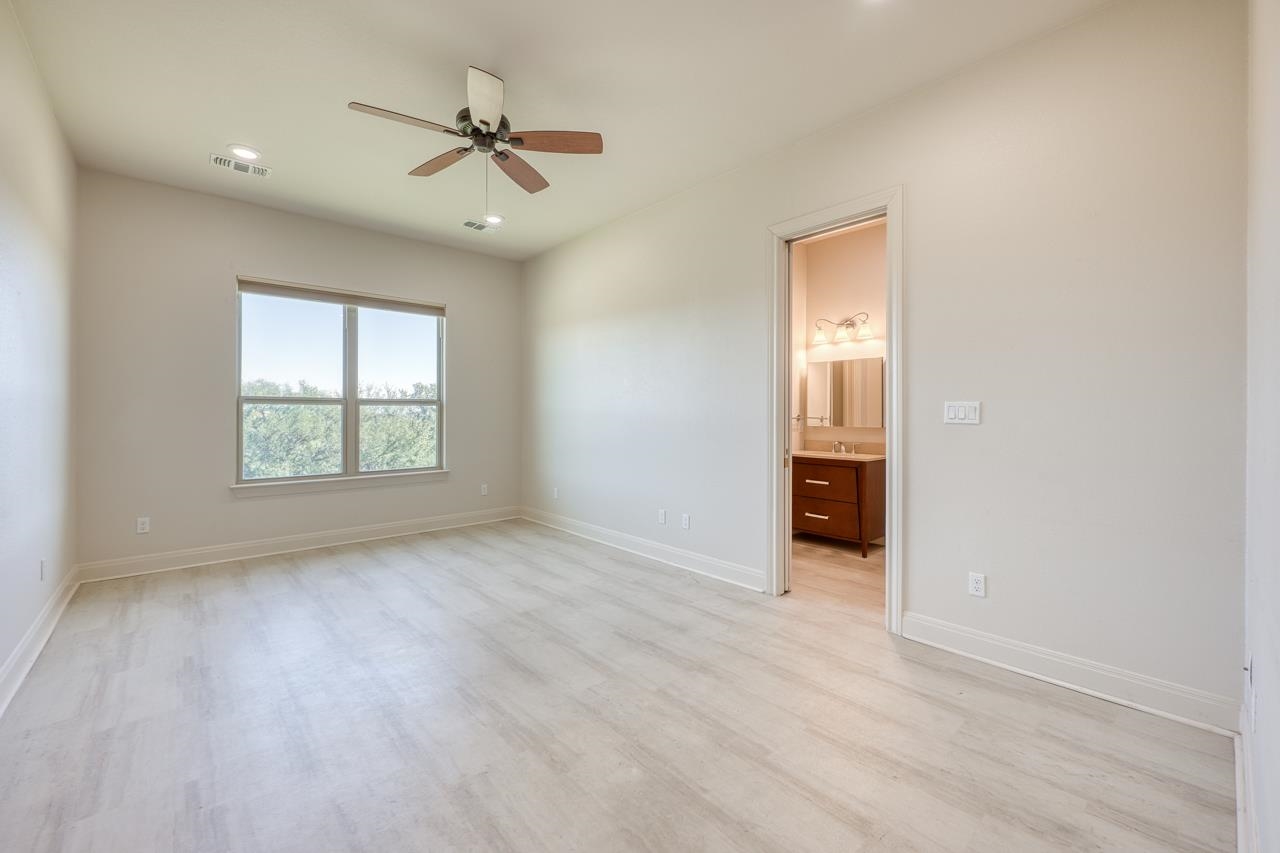 229 Eagle Ridge Burnet, TX 78611 - Photo 28 of 30 wooden floor in an empty room with a window
