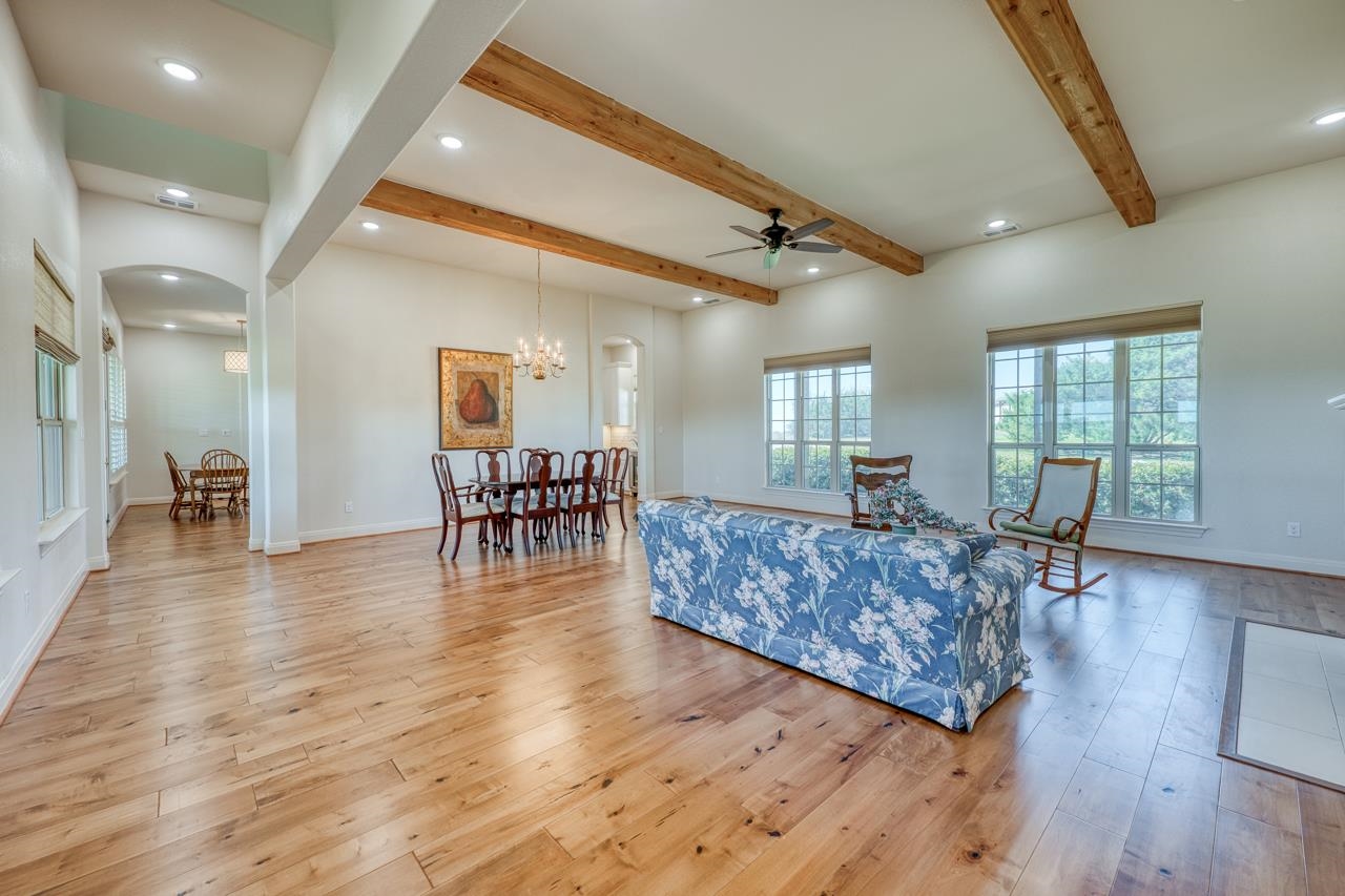 229 Eagle Ridge Burnet, TX 78611 - Photo 8 of 30 a living room with furniture and a wooden floor