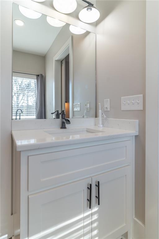 2250 Sperin Road Ball Ground, GA 30107 - Photo 28 of 56 a bathroom with a sink and a mirror