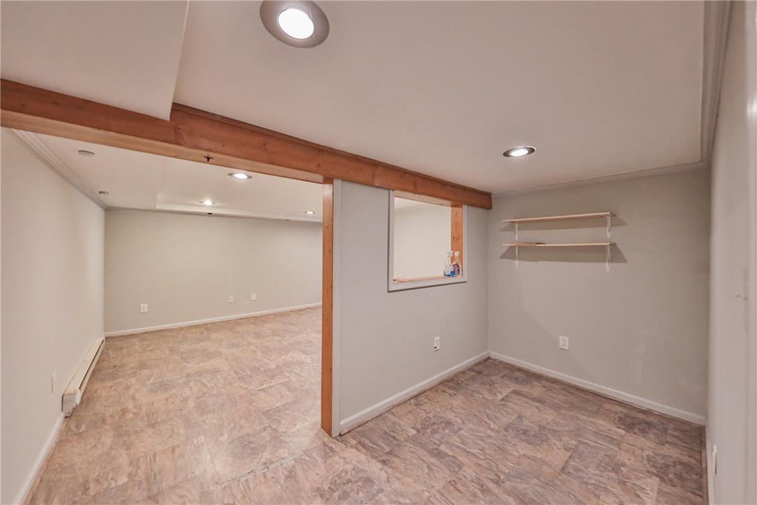 3050 Cornwall Road Bethlehem, PA 18017 - Photo 58 of 80 A well-lit, open-concept basement offering versatile living space with durable flooring.