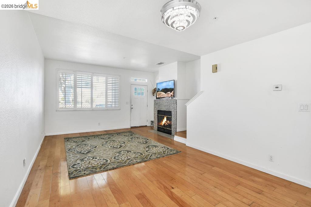 3487 Wells Road Oakley, CA 94561 - Photo 13 of 30 Living room featuring light wood-style floors and a tile fireplace