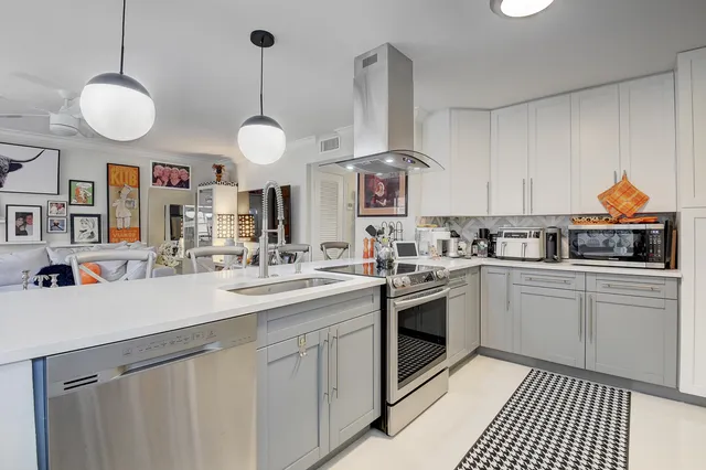 a bathroom with a sink a mirror and a shower
