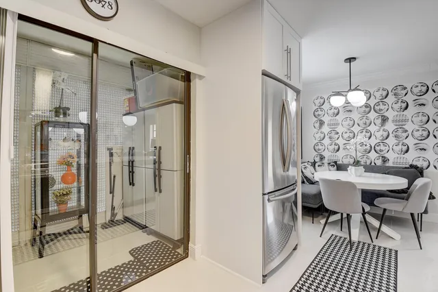 a bathroom with a sink mirror toilet and shower