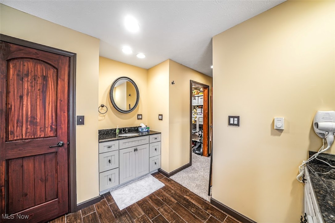 17808 Nash Road Middlefield, OH 44062 - Photo 26 of 43 Full bath featuring vanity, wood tiled floors, and recessed lighting