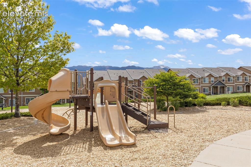 1563 Monterey Road, Unit D Colorado Springs, CO 80910 - Photo 21 of 22 a view of a park with plants and a large tree